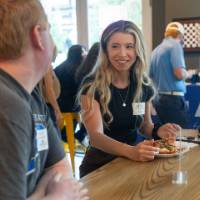 Two event attendees chatting